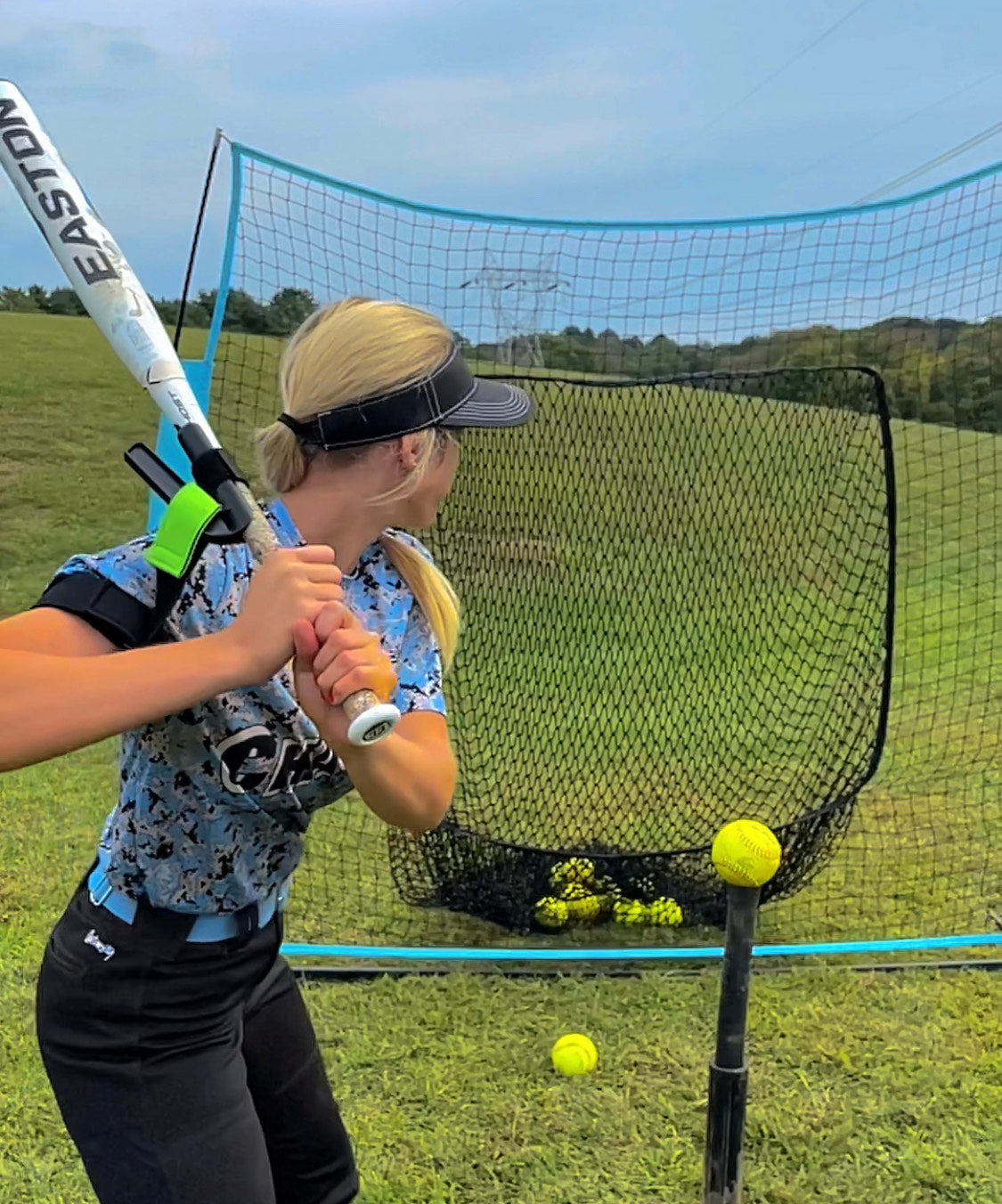 girl swinging a bat using swingrail