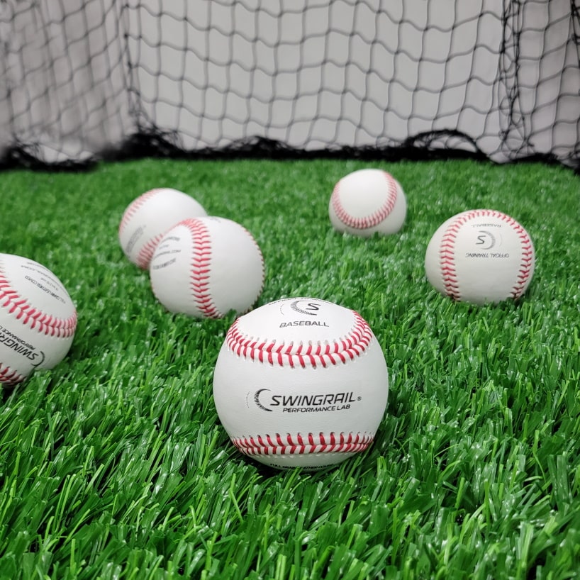 baseballs shown on turf