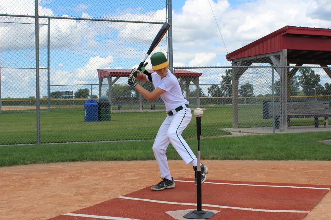 baseball player using swingrail swing trainer