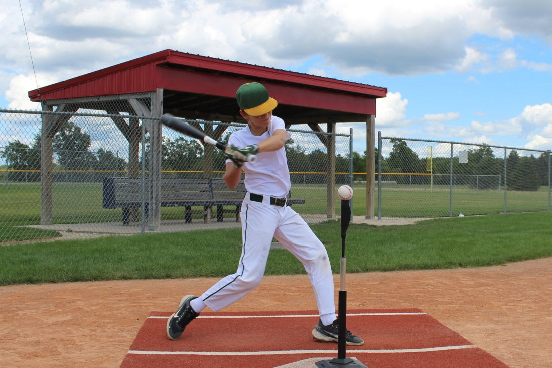baseball player using swingrail swing trainer