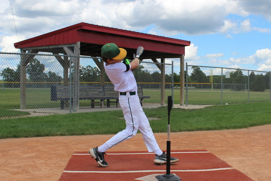 baseball player using swingrail swing trainer