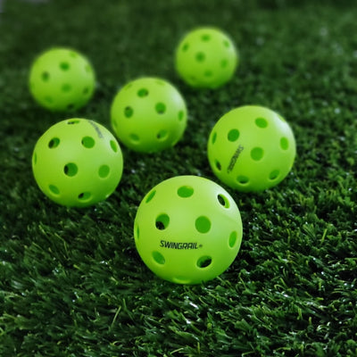 plastic baseballs shown on turf